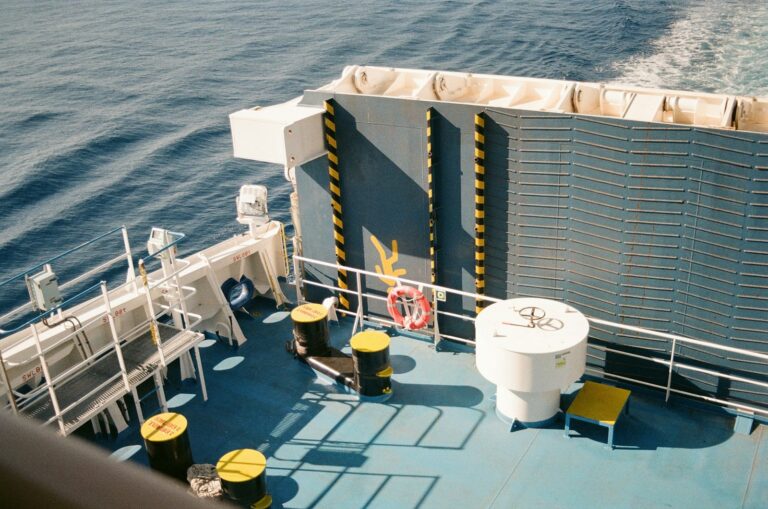 Deck of a ship sailing on the blue ocean.